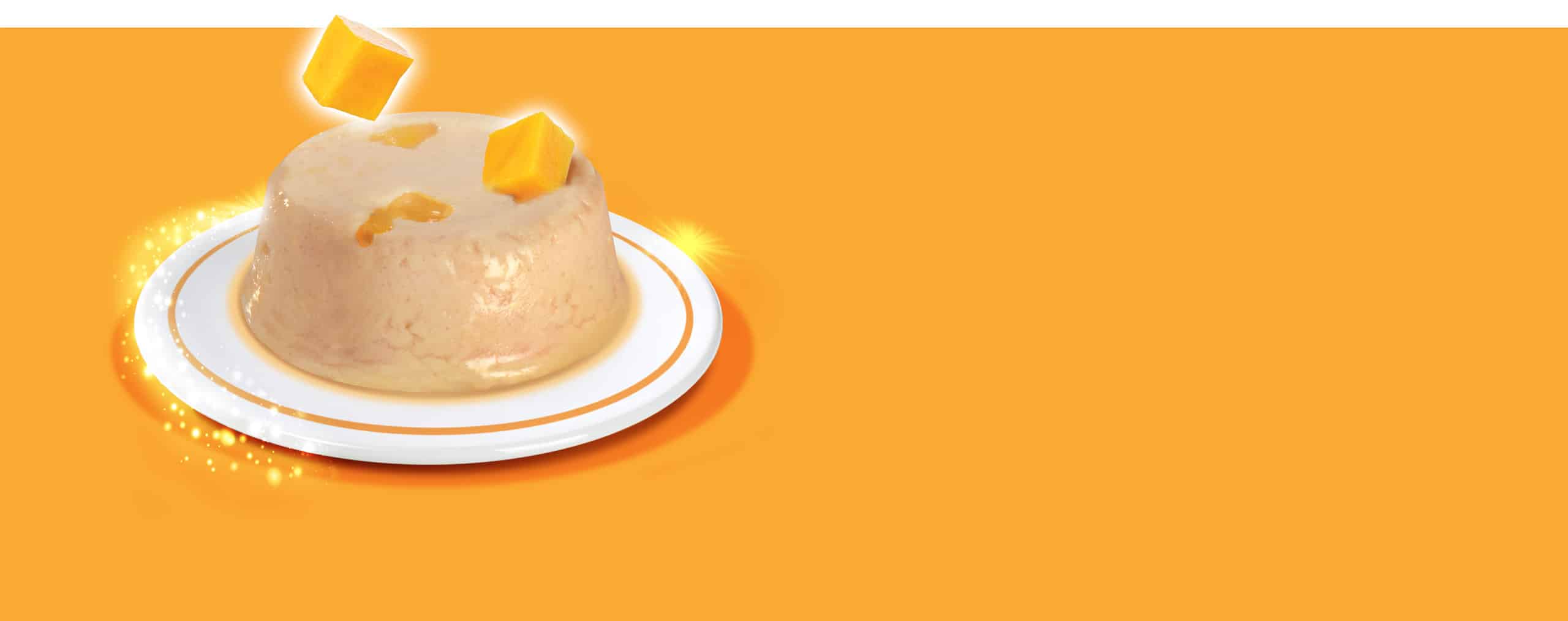 A serving of chicken mousse topped with mango cubes on a white plate against an orange background