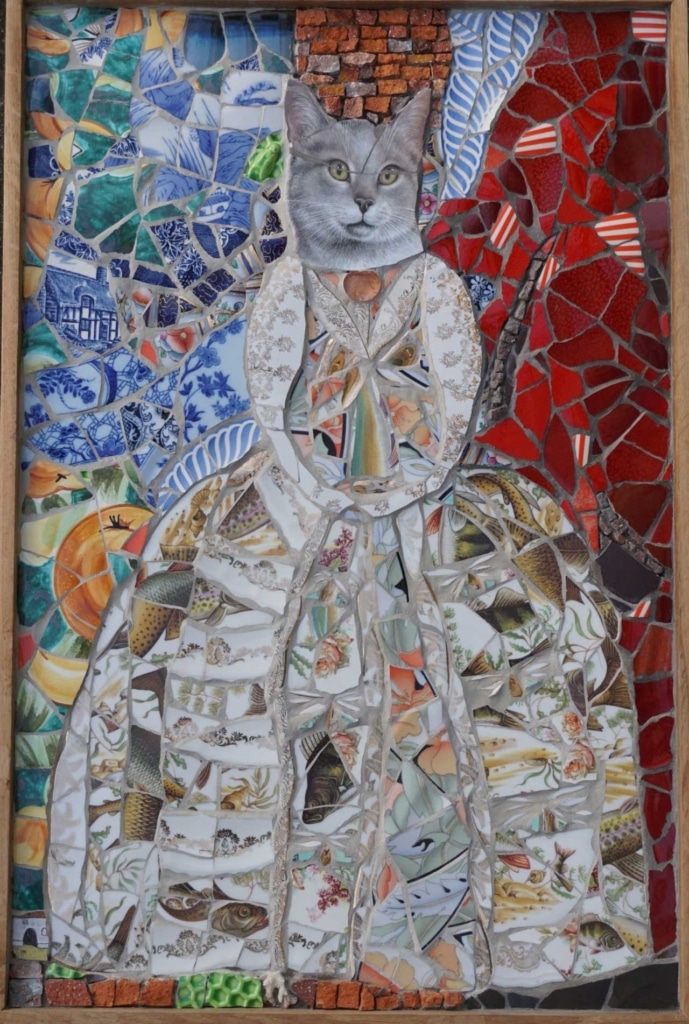 Mosaic artwork featuring a gray cat's head collaged onto a figure wearing a dress made of broken ceramic fish plates