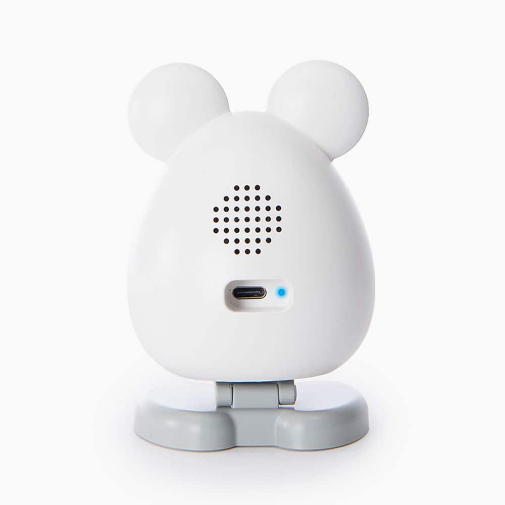 Back view of a white, mouse-shaped Catit PIXI Smart Camera with a speaker grille and USB-C port on a grey base