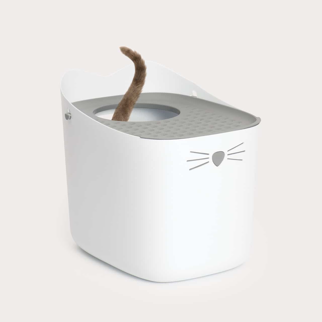 White cat-shaped litter box with a grey lid and a cat tail sticking out of the top opening