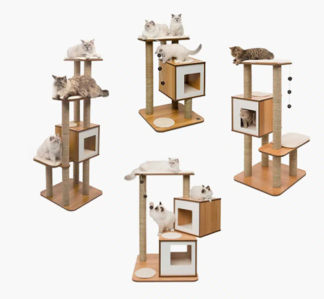 Four different models of Catit Vesper cat furniture with cats sitting on and inside the structures