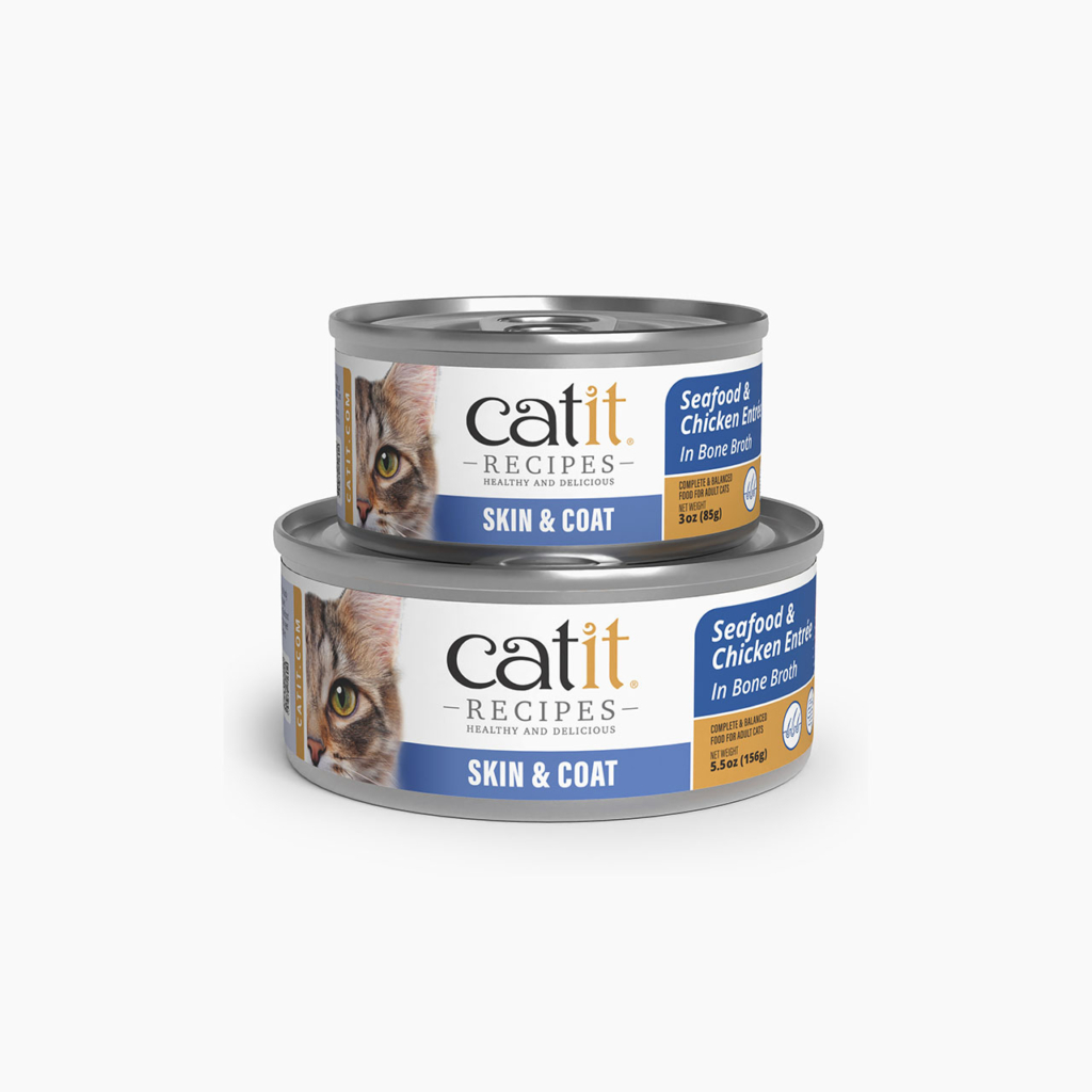 Two cans of Catit Recipes Skin & Coat Seafood & Chicken Entrée in Bone Broth cat food, one 3oz and one 5.5oz