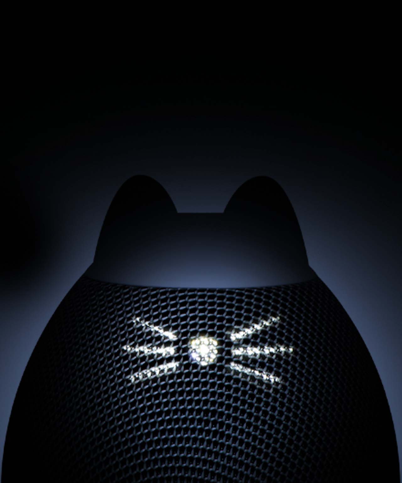 A black, cat-shaped PIXI smart water fountain with illuminated whiskers on the front mesh panel