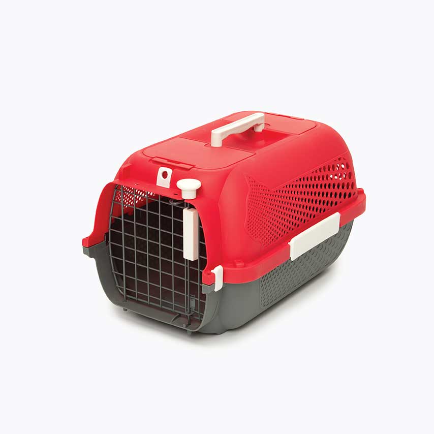 Red and grey plastic pet carrier with a wire door and top handle