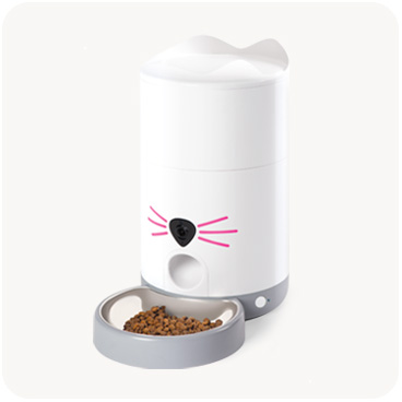 Catit PIXI smart automatic cat feeder with a white cat-shaped body and a grey food bowl containing kibble