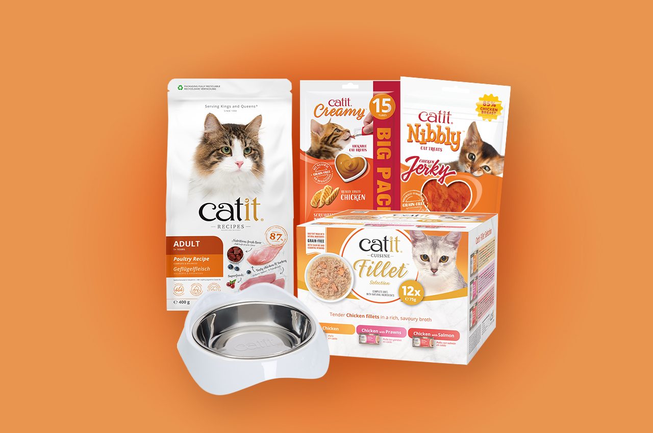 Catit cat food, treats, and a stainless steel bowl on an orange background