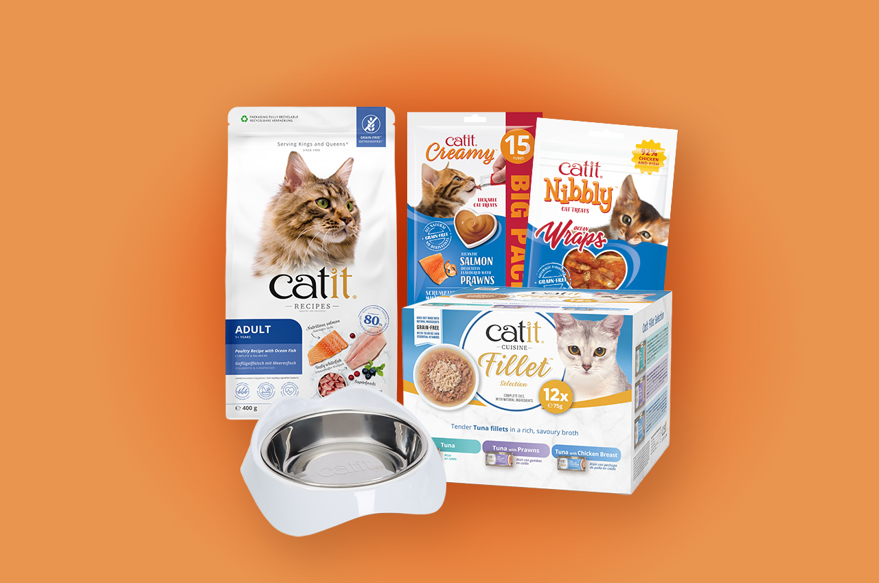 Catit cat food, treats, and a stainless steel bowl on an orange background