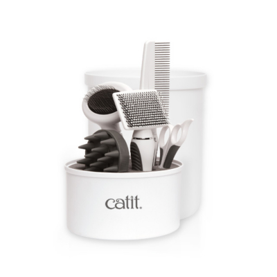 Catit grooming kit for shorthair cats, featuring a storage container with a comb, brushes, and grooming scissors