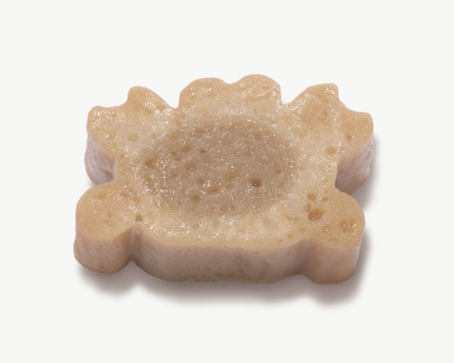 Crab-shaped cat treat on a white background