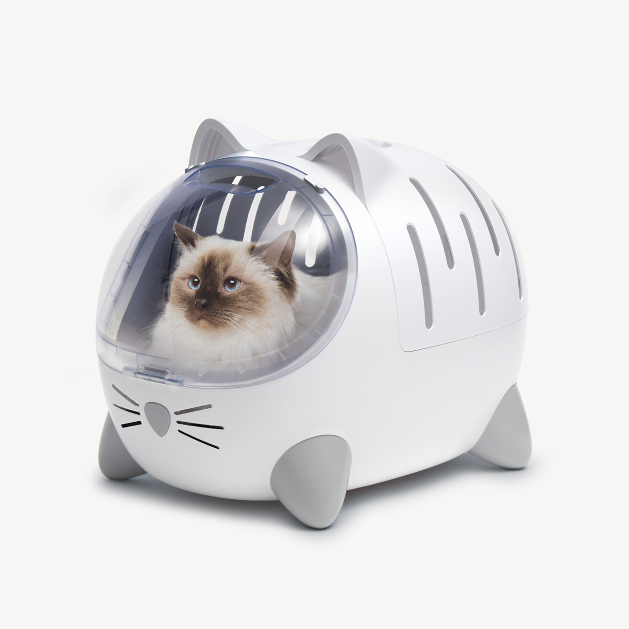 A white Catit PIXI cat carrier with a clear bubble window and a Ragdoll cat inside