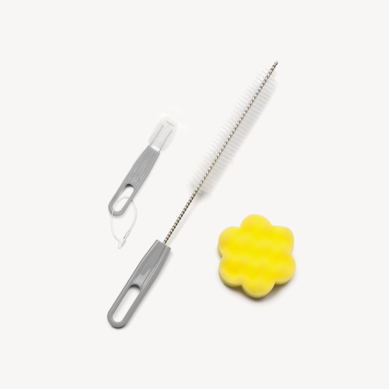 Catit fountain cleaning set with two grey brushes and a yellow flower-shaped sponge