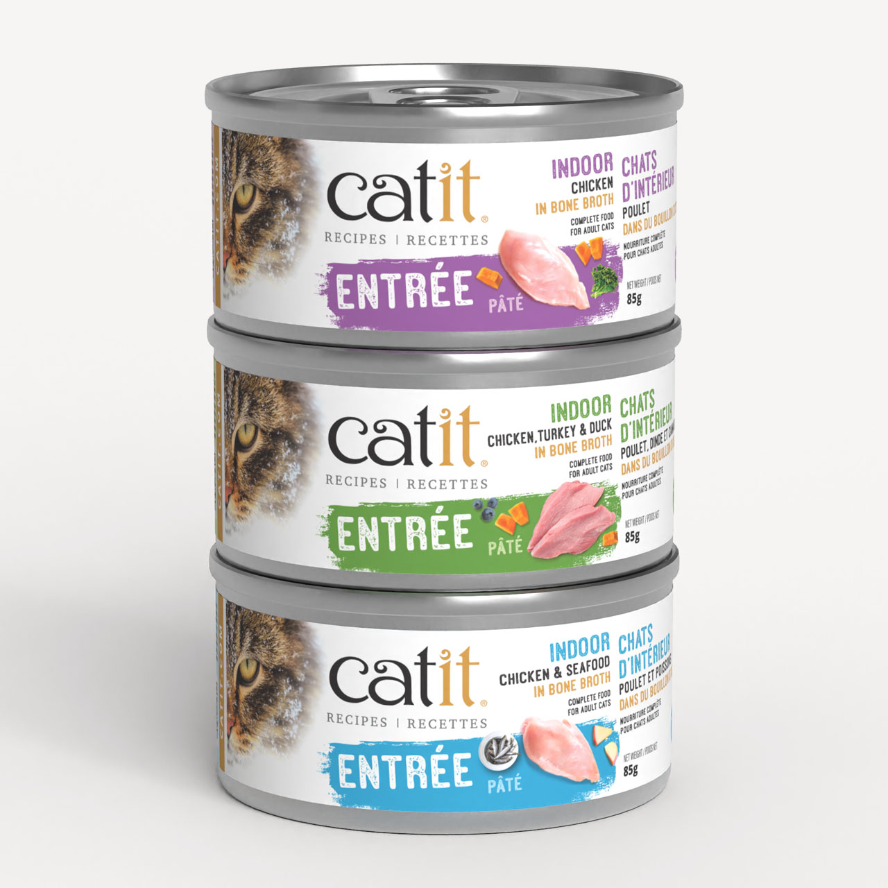 Three stacked cans of Catit Indoor cat food pâté in chicken, chicken-turkey-duck, and chicken-seafood flavors