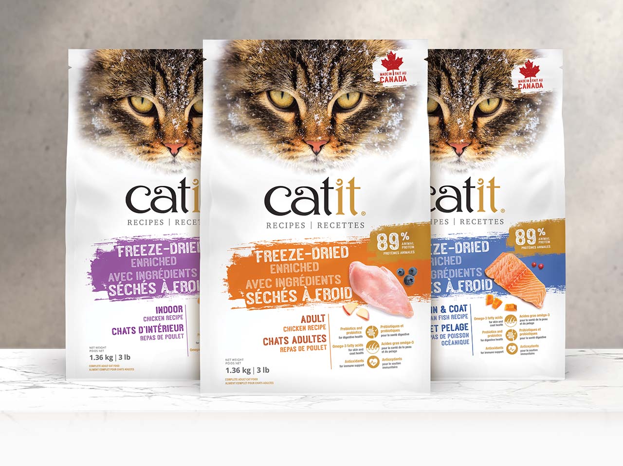 Three bags of Catit freeze-dried cat food in Indoor, Adult Chicken, and Skin & Coat Fish recipes