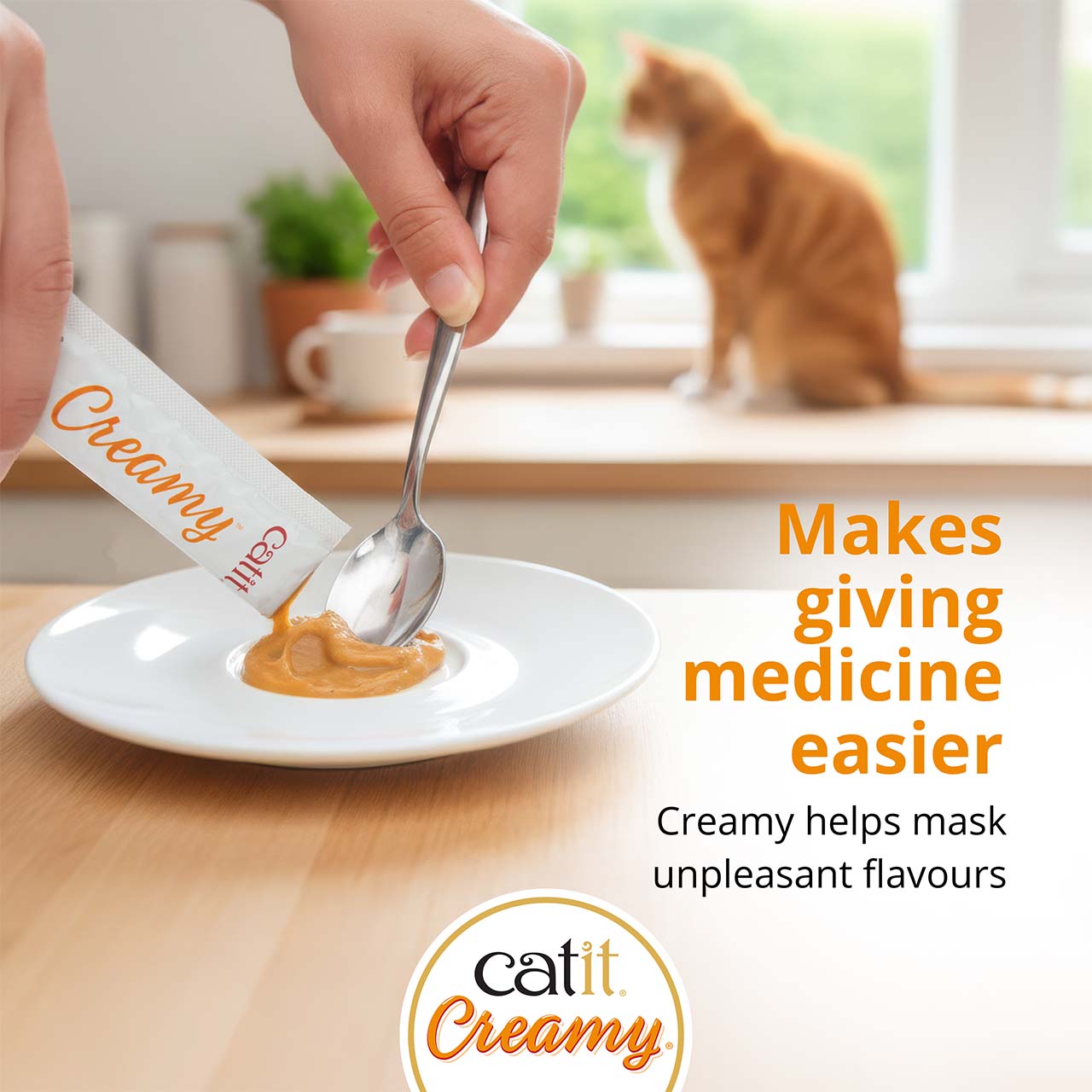 Catit Creamy treat being squeezed onto a spoon to help mask the taste of medicine for cats