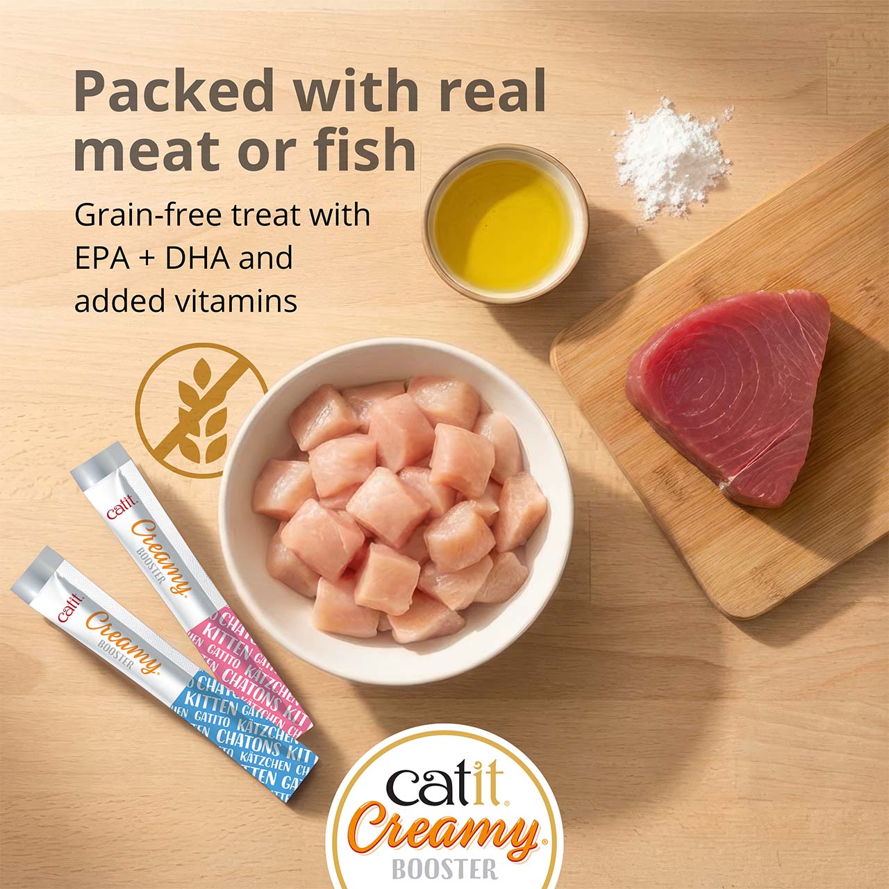 Catit Creamy Booster kitten treats, featuring real meat or fish, grain-free ingredients, EPA, DHA, and added vitamins