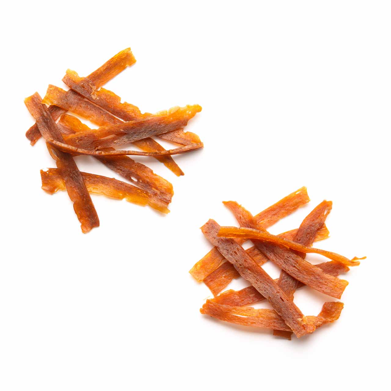 Two small piles of thin, dried meat strips for cats on a white background