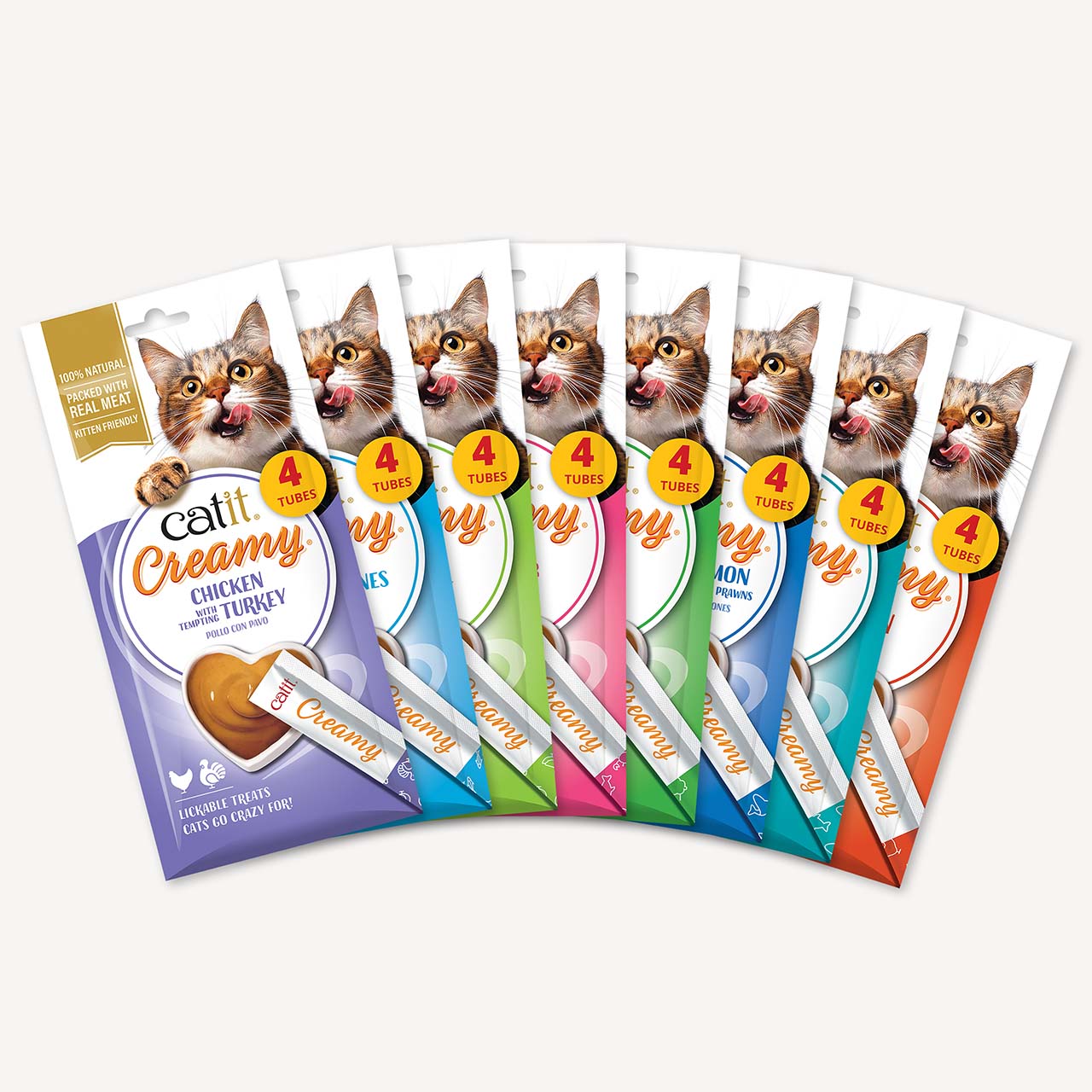 A fan arrangement of eight Catit Creamy lickable cat treat packages in various flavors