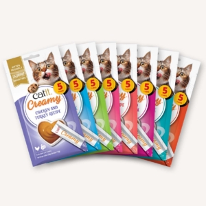 A fan of eight Catit Creamy lickable cat treat packages in various flavors, each containing five tubes