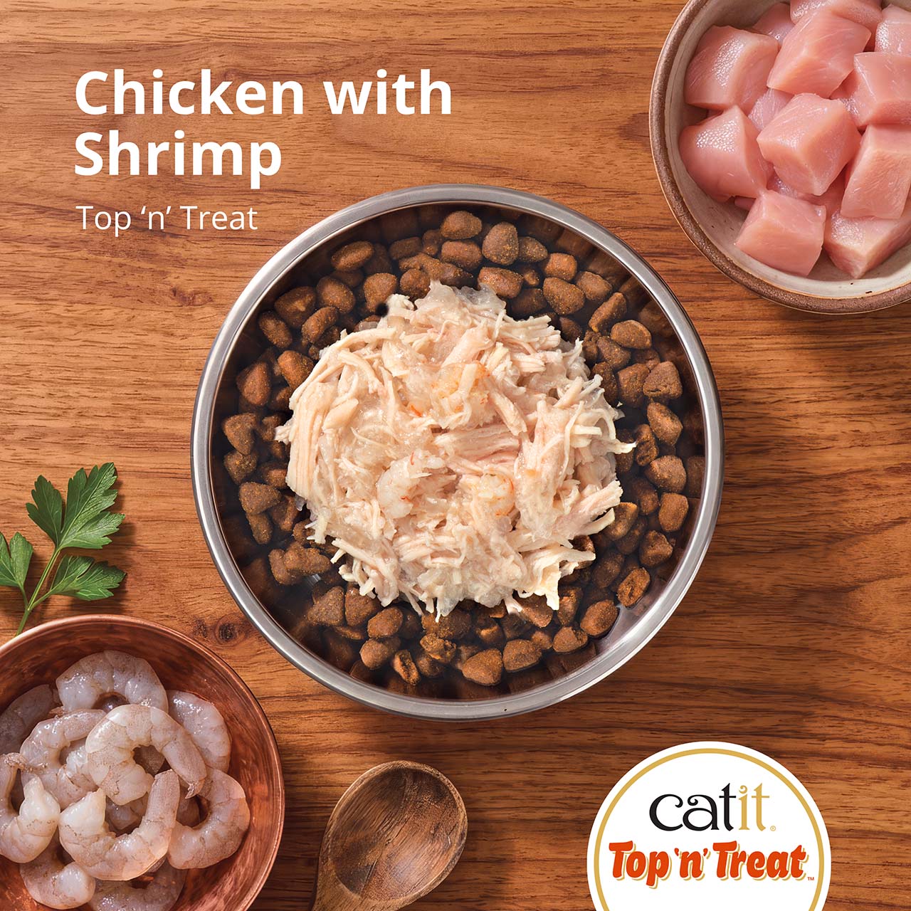 Catit Top 'n' Treat Chicken with Shrimp cat food topper served in a bowl with raw chicken and shrimp on the side