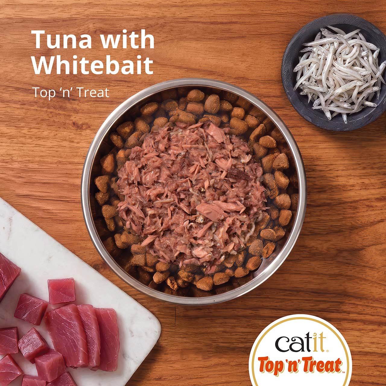 Catit Top 'n' Treat Tuna with Whitebait cat food in a bowl with fresh tuna and whitebait on the side