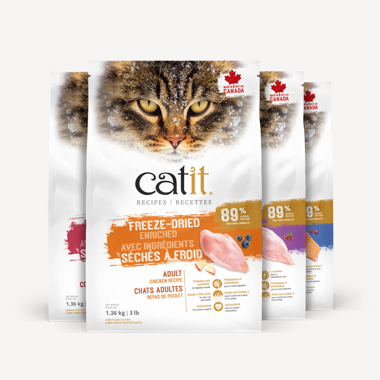 Four bags of Catit freeze-dried cat food, featuring chicken and salmon recipes, displayed in a row