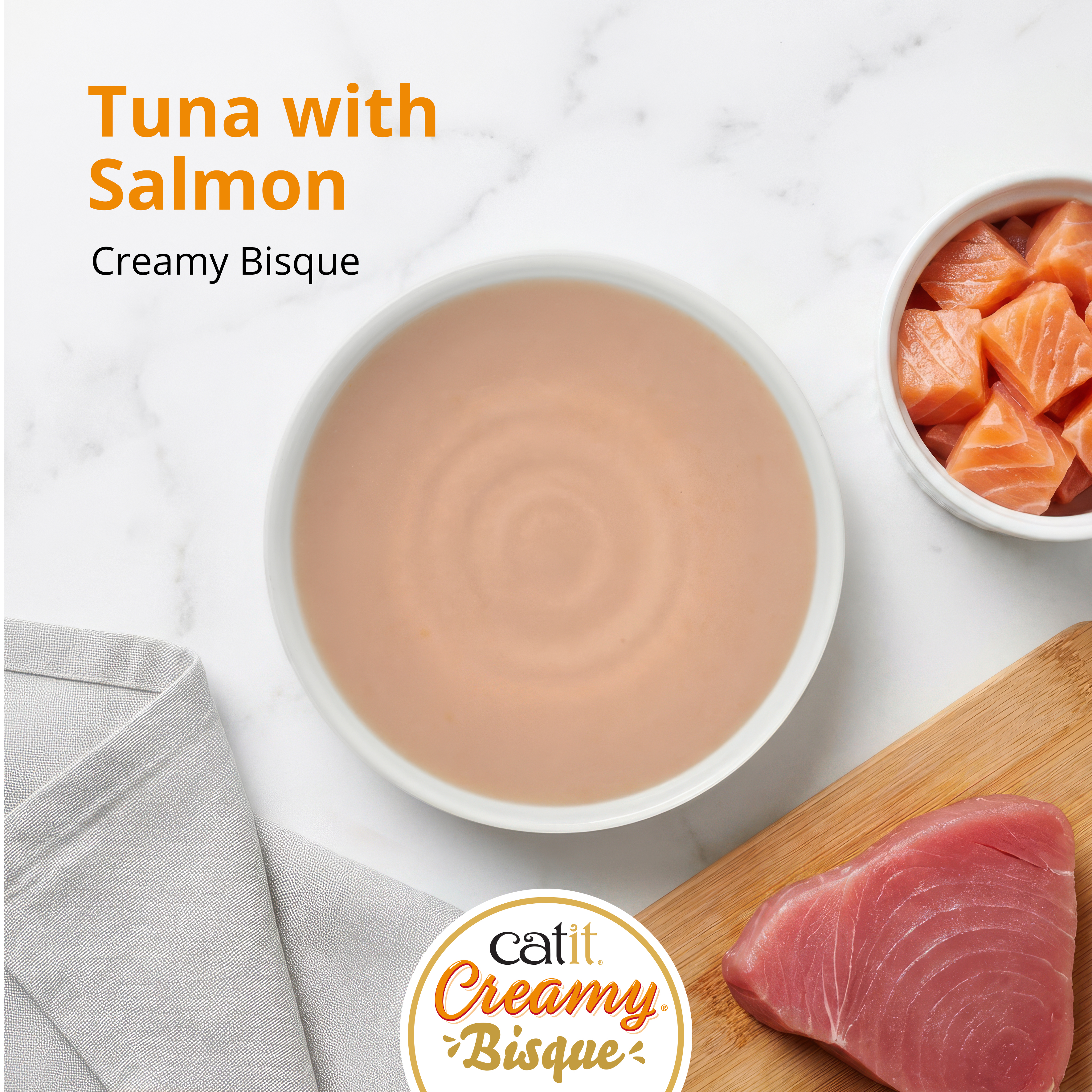 Catit Creamy Bisque cat treat in tuna and salmon flavor, featuring a bowl of bisque with fresh tuna and salmon pieces