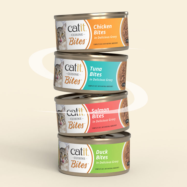 A vertical stack of four Catit Cuisine Bites cat food cans in chicken, tuna, salmon, and duck flavors