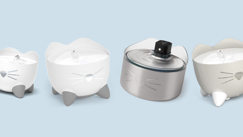 Four PIXI cat water fountains in various colors and styles arranged on a light blue background