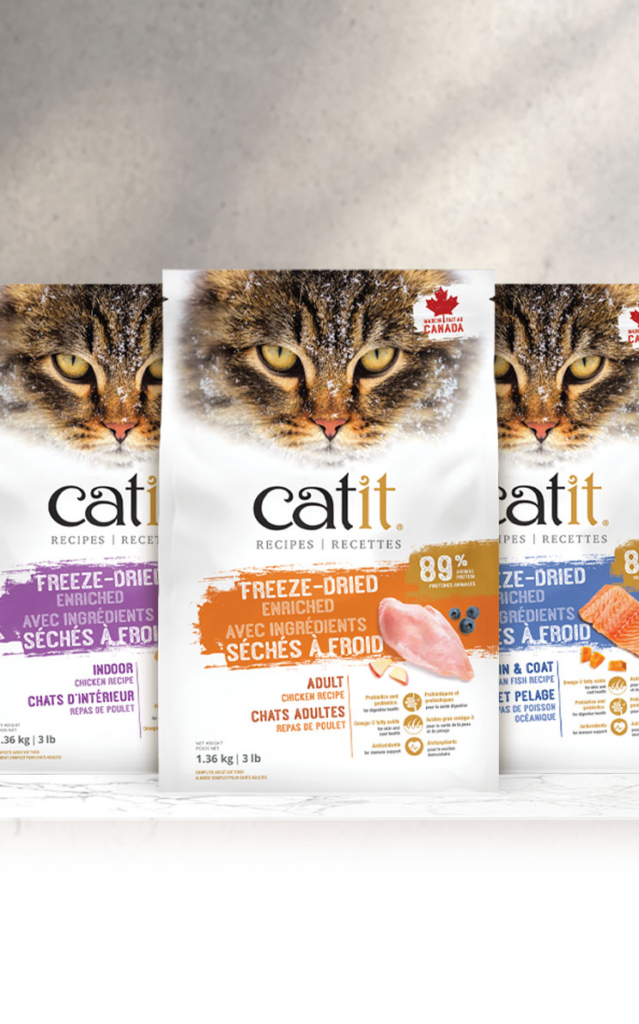 Three bags of Catit freeze-dried cat food in different recipes: Indoor Chicken, Adult Chicken, and Skin & Coat Fish