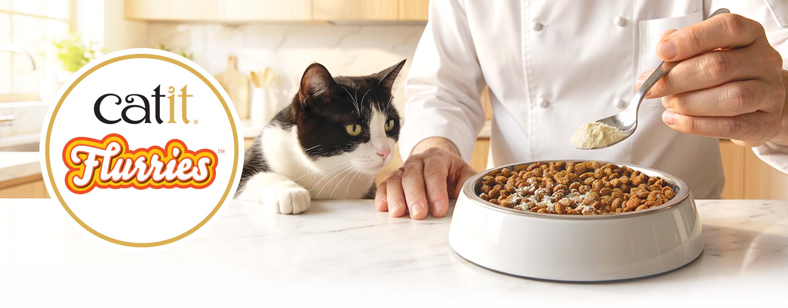 A chef sprinkles Catit Flurries food topper onto a bowl of dry cat food while a cat watches expectantly