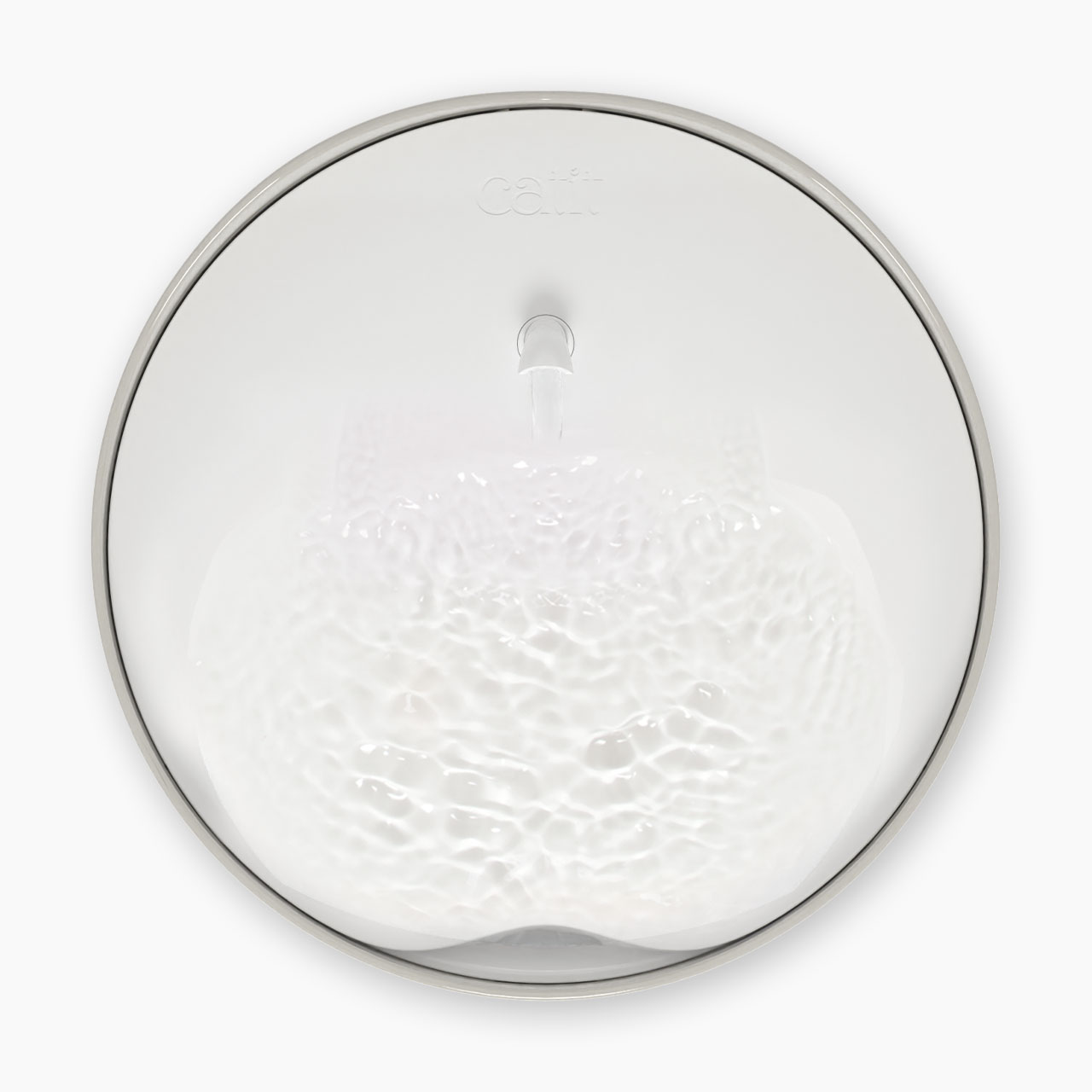 Top-down view of a white Catit PIXI cat water fountain with a central spout and rippling water surface