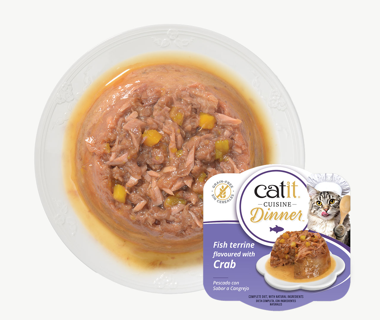 Catit Cuisine Dinner fish terrine flavoured with crab cat food served on a white plate with product packaging