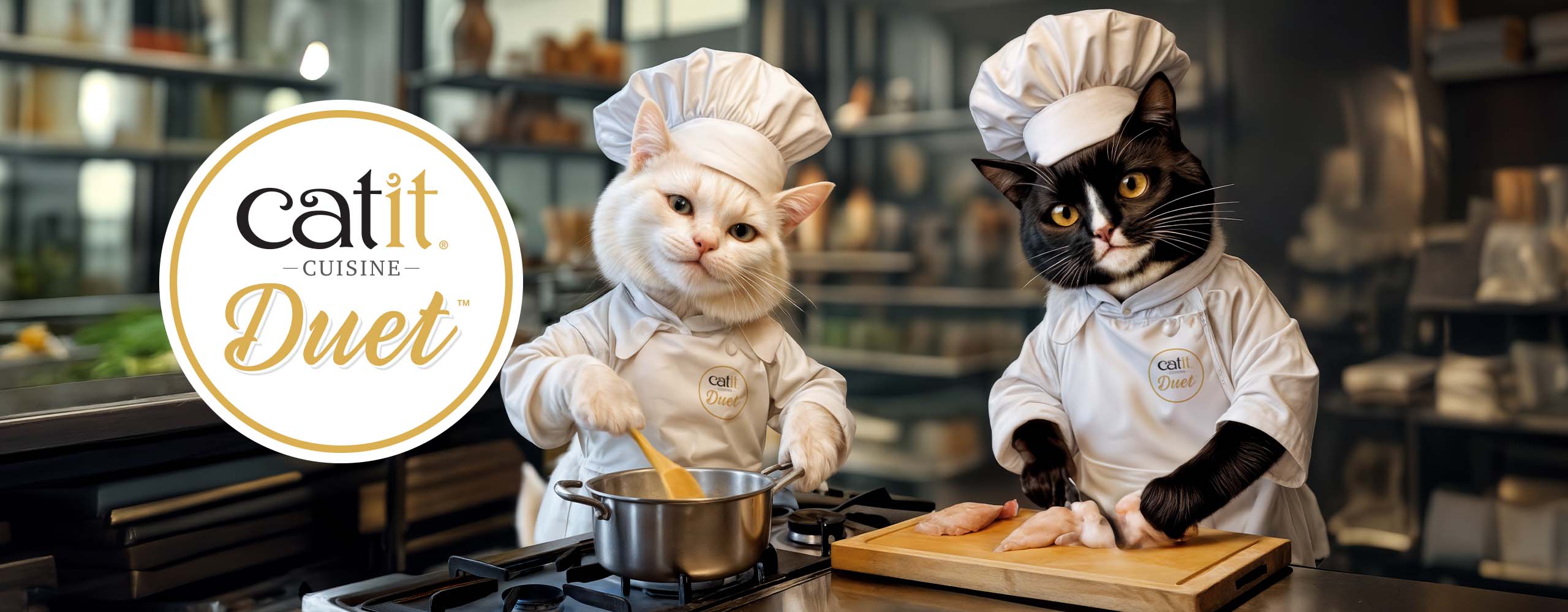Two cats dressed as chefs in a kitchen, one stirring a pot and the other preparing food on a cutting board, for Catit Duet