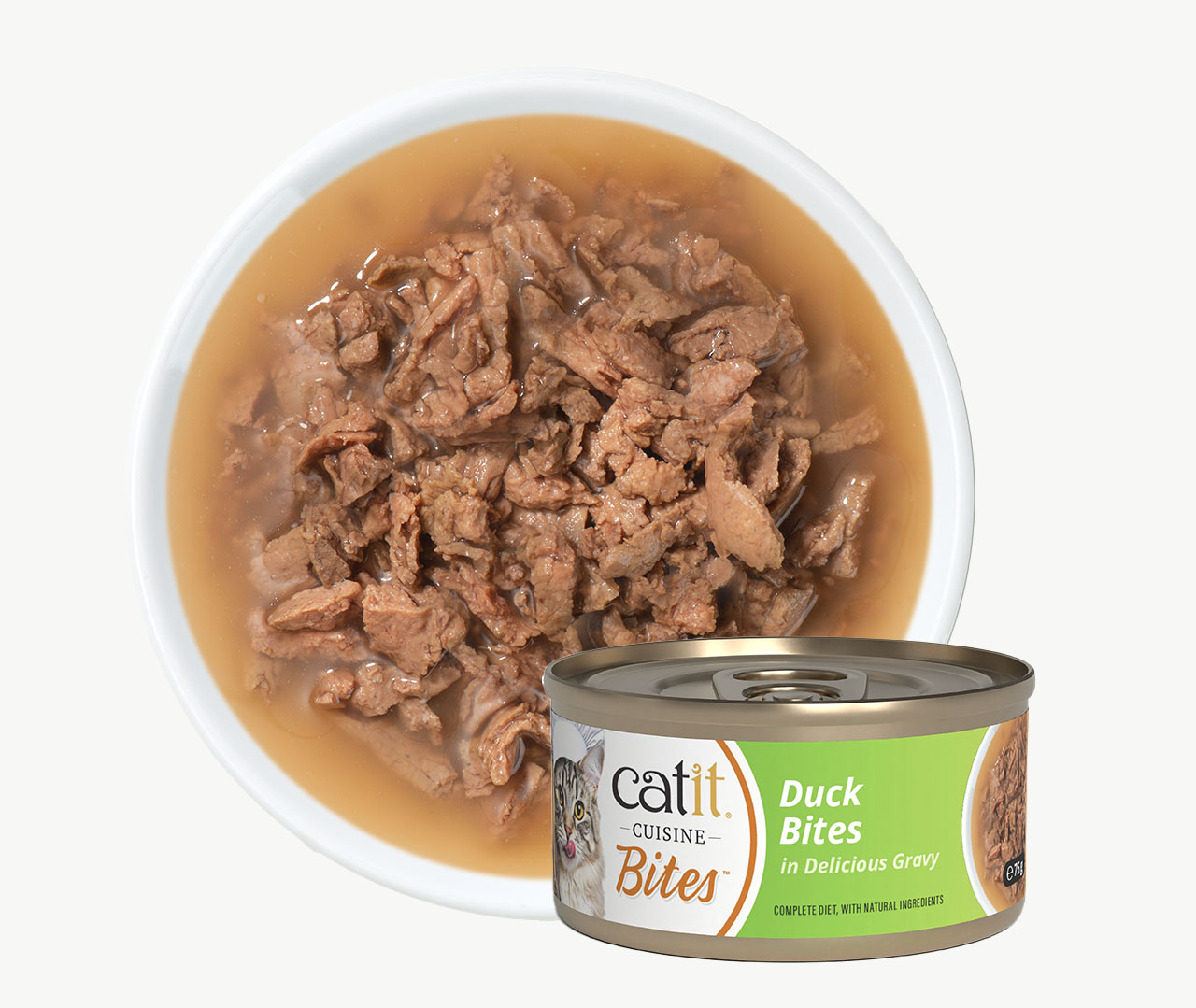 A bowl of Catit Cuisine Duck Bites cat food in gravy next to its product packaging