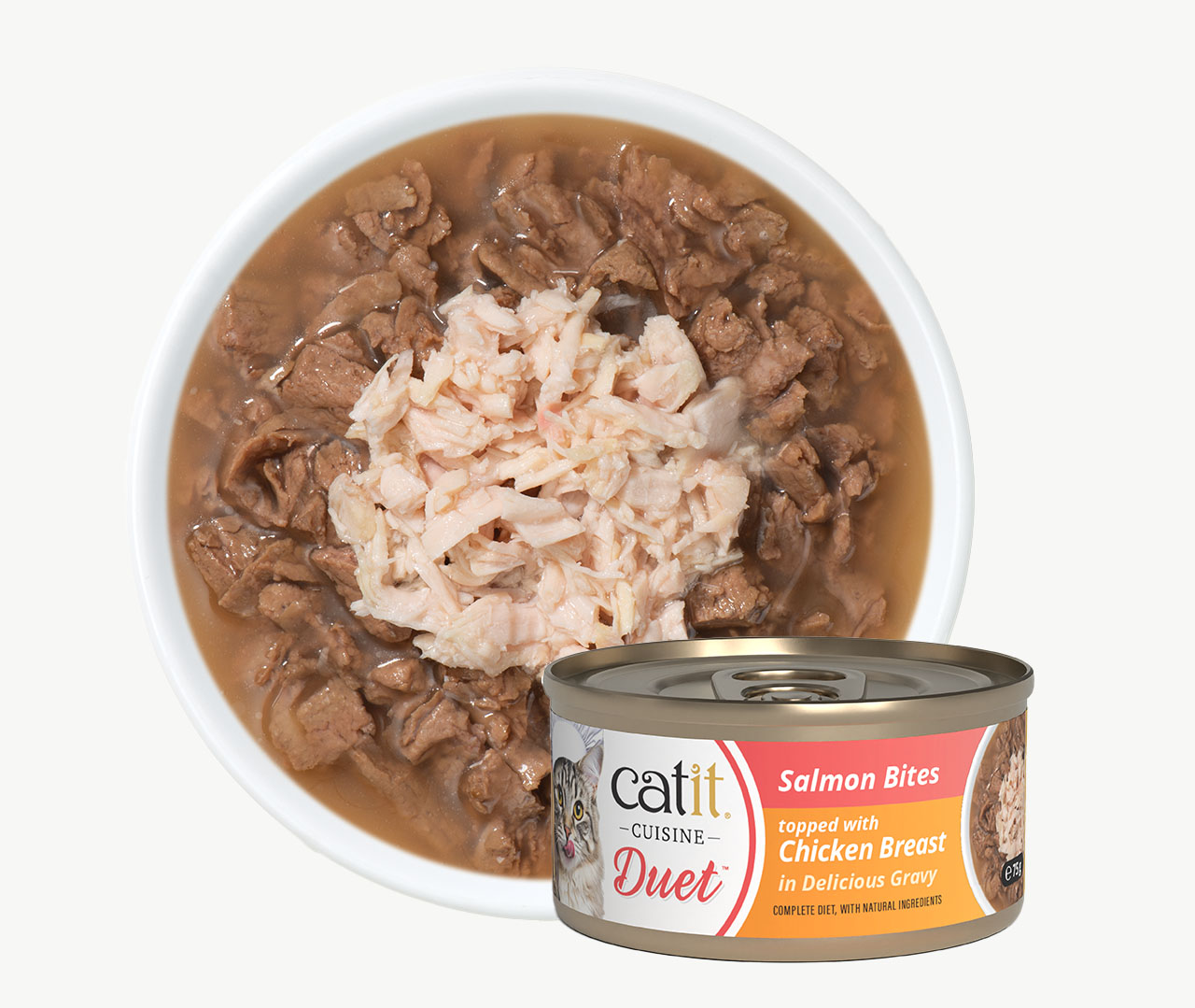 Catit Cuisine Duet wet cat food in a bowl with a can of Salmon Bites topped with Chicken Breast in gravy