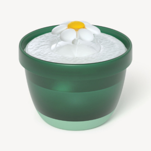 Green and light green plastic cat water fountain with a white and yellow flower-shaped spout