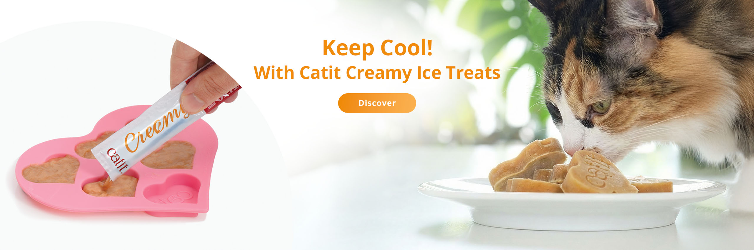 Promotional banner for Catit Creamy Ice Treats showing a hand filling a heart-shaped mold and a cat eating the treats