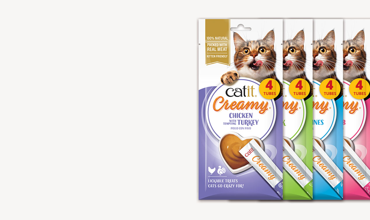 Catit Creamy lickable cat treats in various flavors, each pack containing four tubes