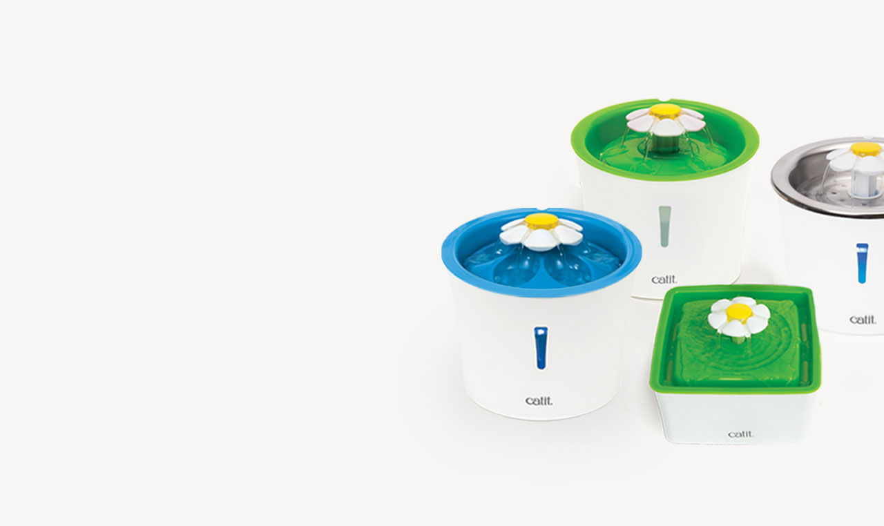 Four Catit flower-themed water fountains for cats in various colors and shapes on a white background