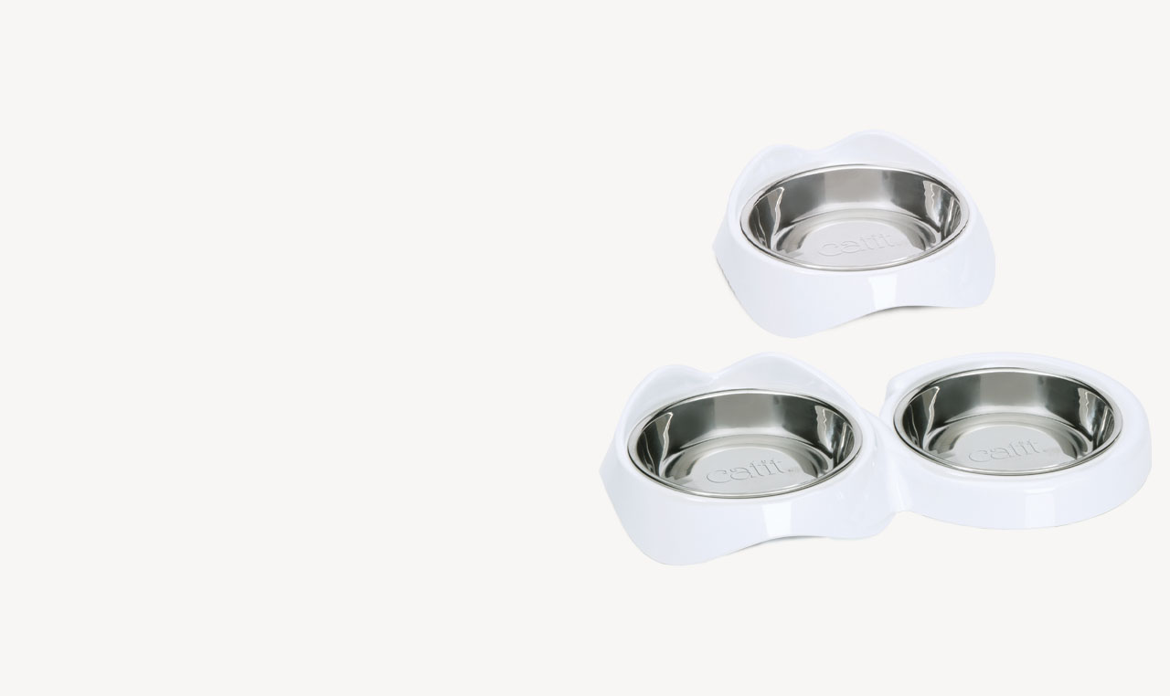 Single and double Catit PIXI stainless steel feeding dishes with white plastic bases
