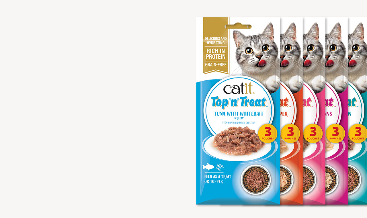 Catit Top n Treat cat food pouches in various flavors featuring a cat licking its lips