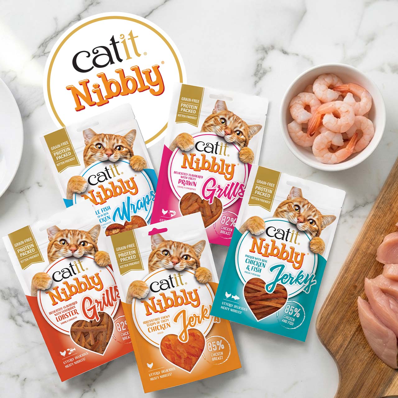 Catit Nibbly cat treat packaging in various flavors including chicken, fish, prawn, and lobster