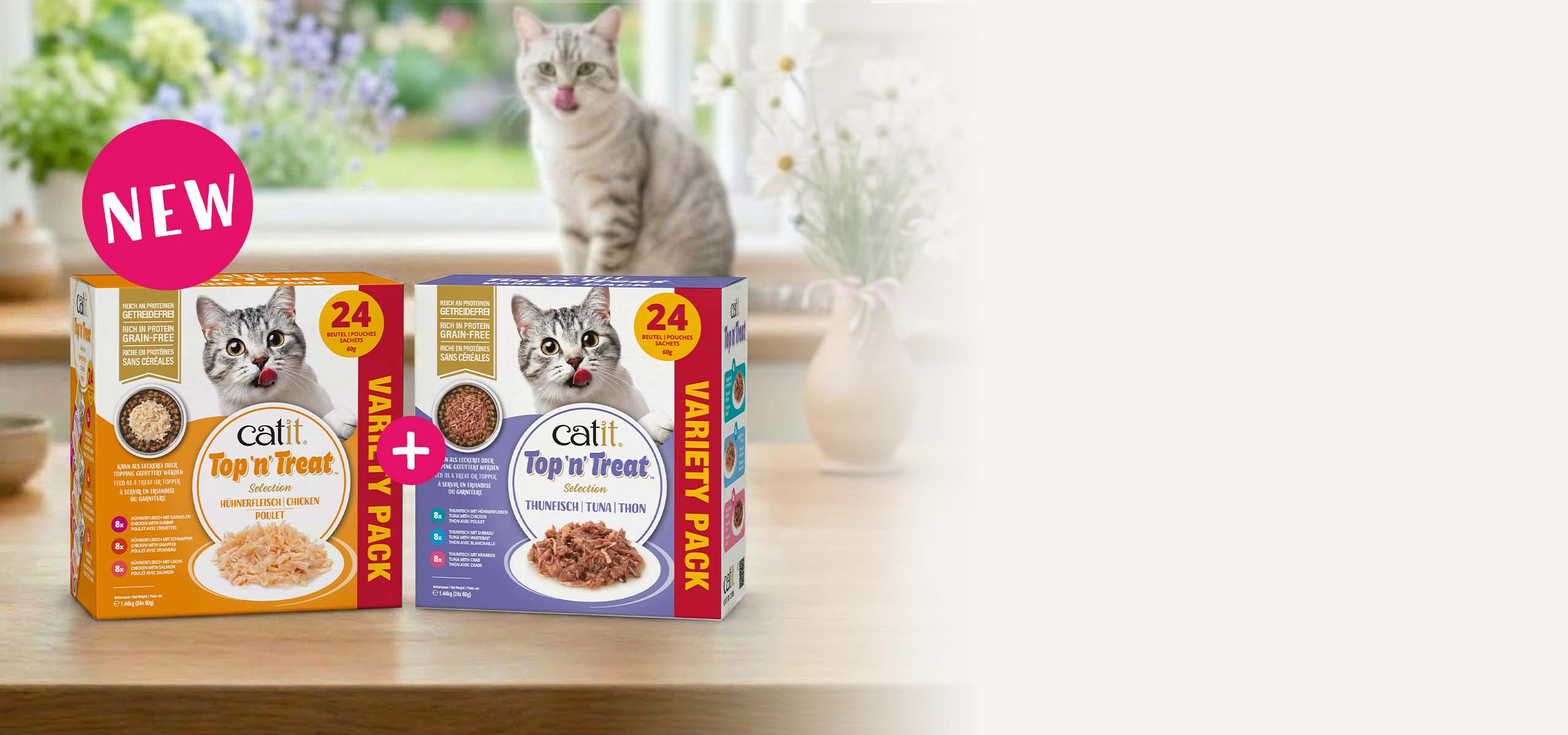 Catit Top'n'Treat variety packs standing on kitchen countertop with cat in the back