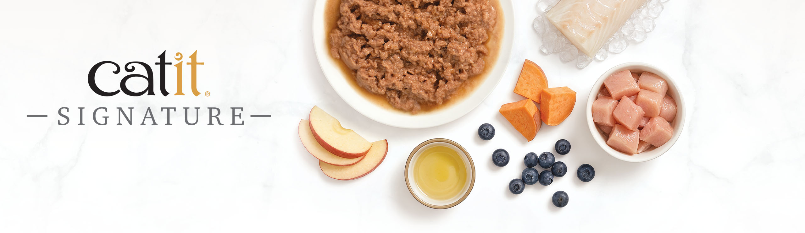 Catit Signature wet cat food ingredients including meat, fish, sweet potato, apple, and blueberries on a white background