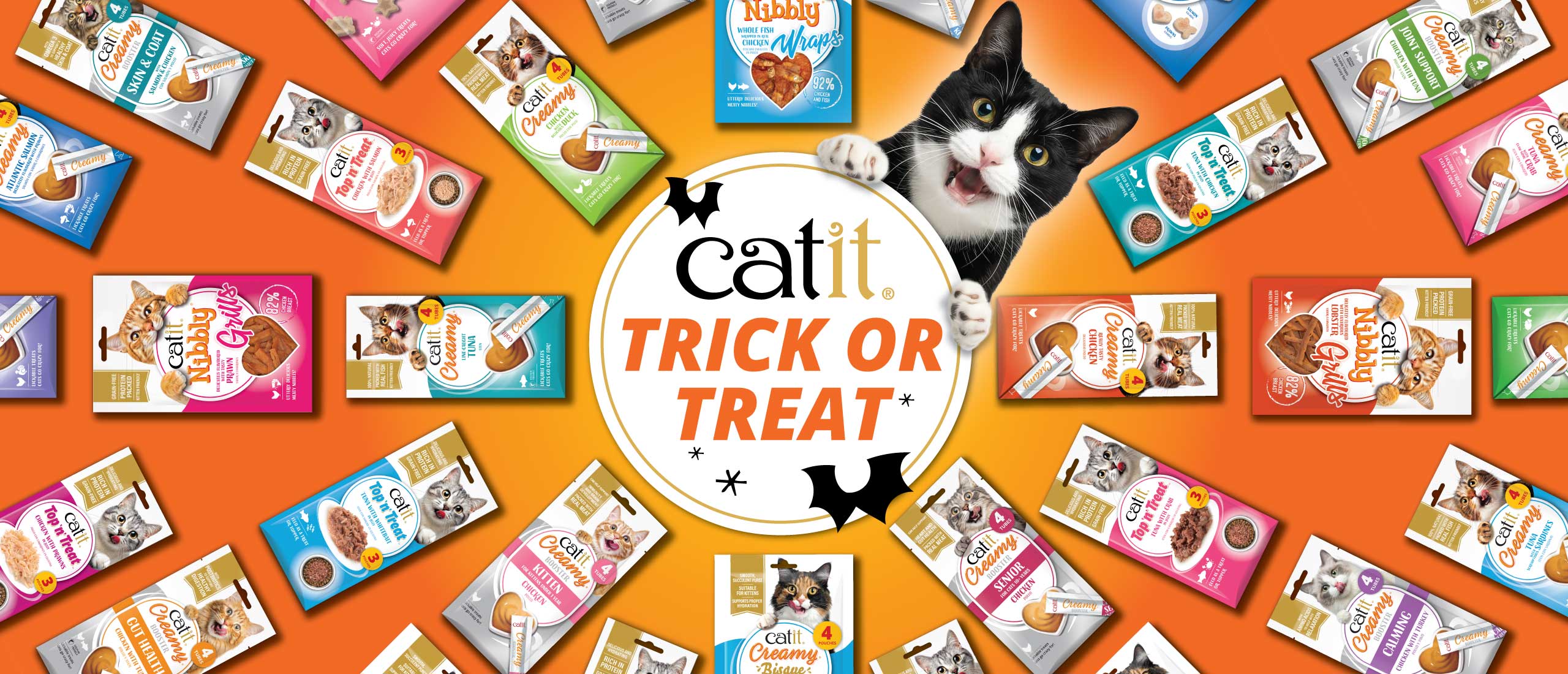 Circle in middle with Trick or Treat in surrounded with Catit treats Packagings and cat smiling holding the circle