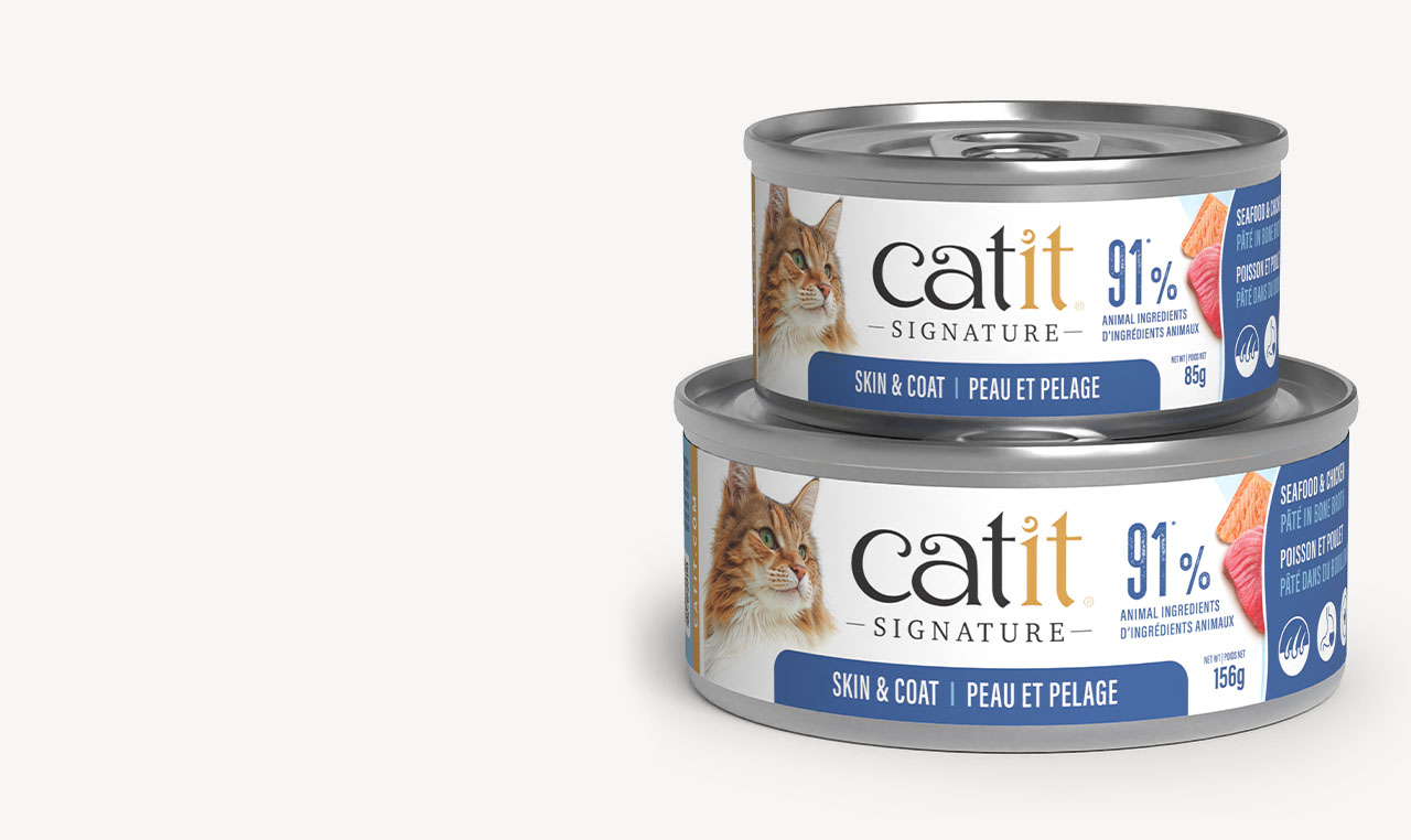 Two cans of Catit Signature Skin & Coat 85g and 156g