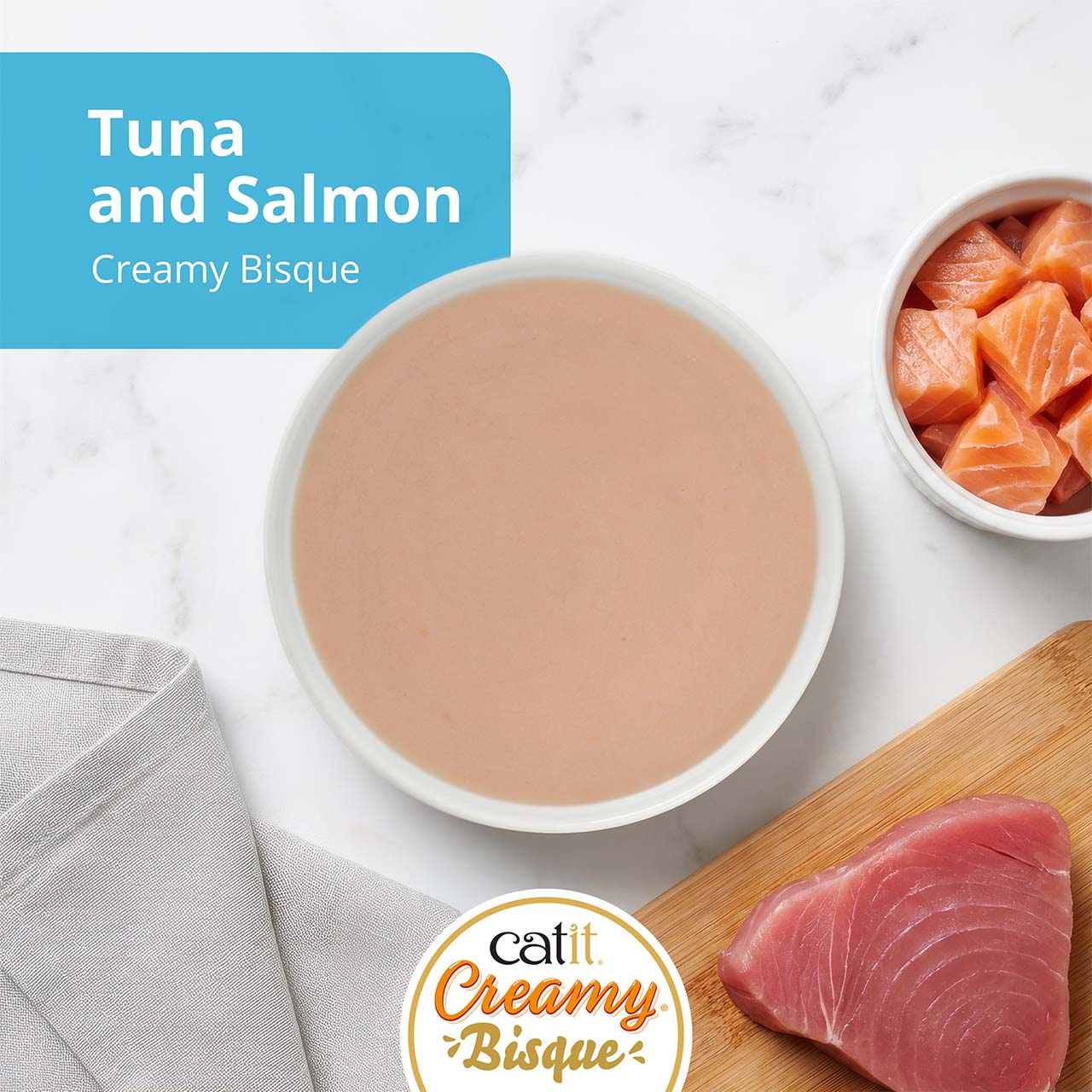 Catit Creamy Bisque cat treat in tuna and salmon flavor, featuring a bowl of bisque with fresh tuna and salmon pieces