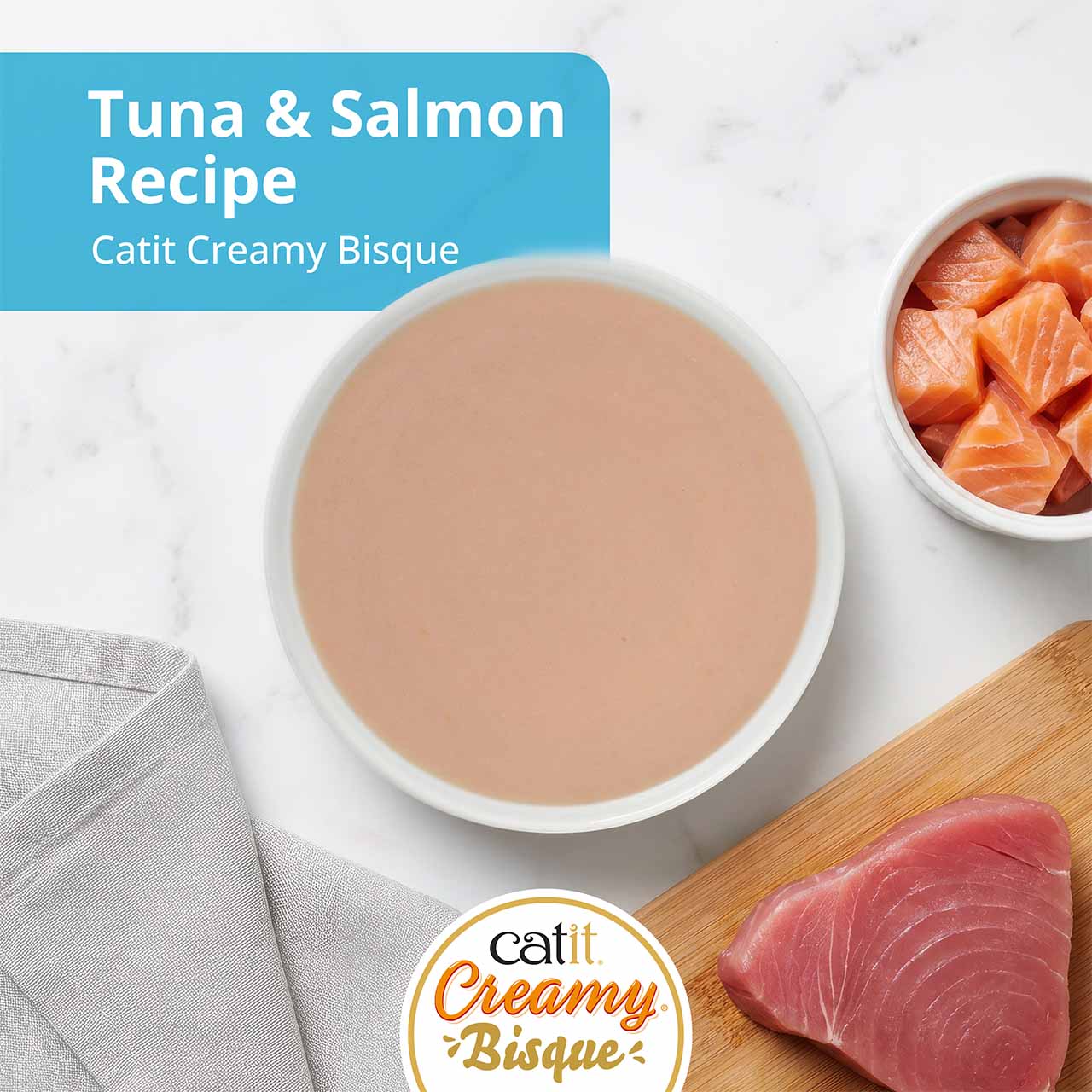 Catit Creamy Bisque cat treat in tuna and salmon flavor, featuring a bowl of bisque with fresh tuna and salmon pieces