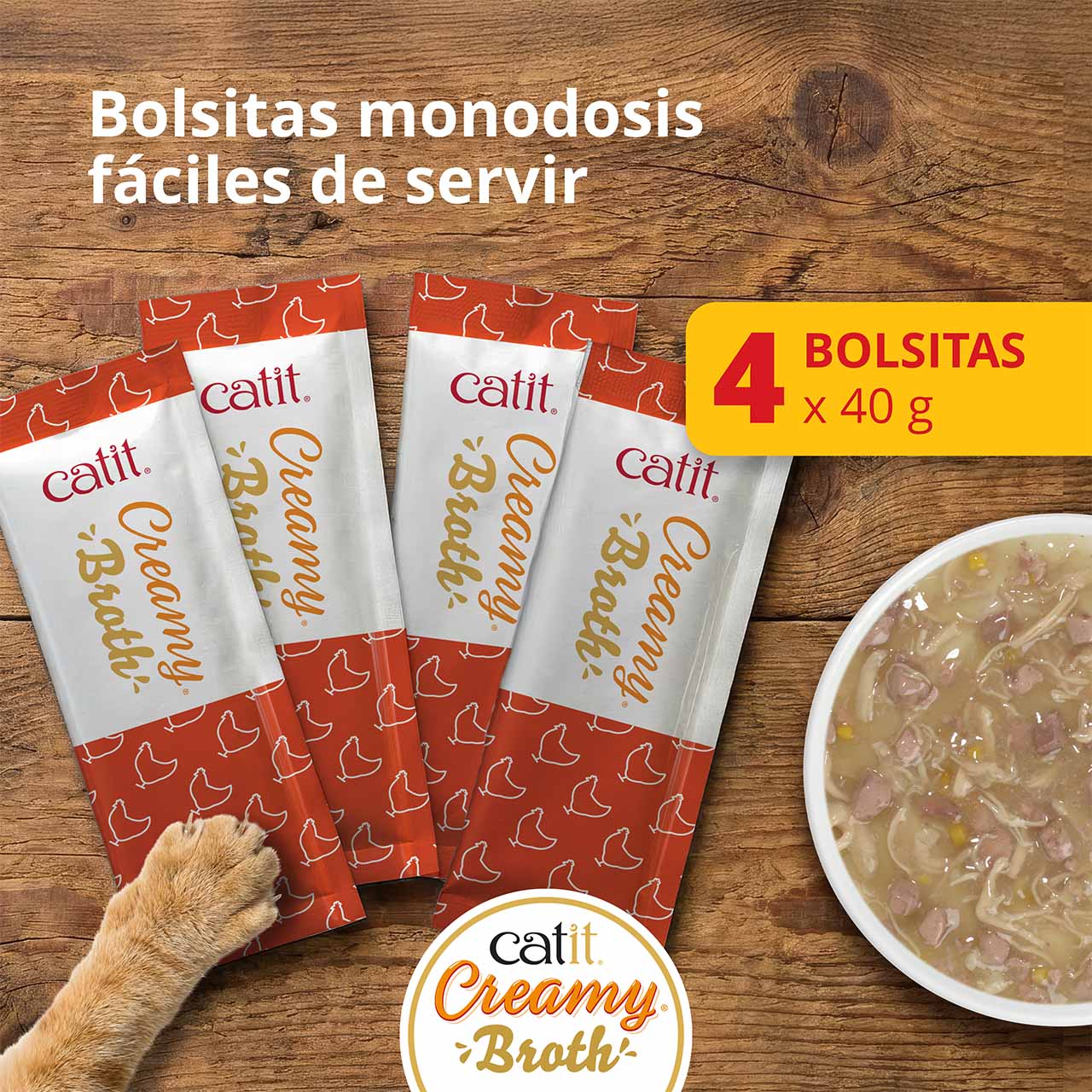 4 bolsitas individuales de 40 g de Catit Creamy Broth en la encimera de madera