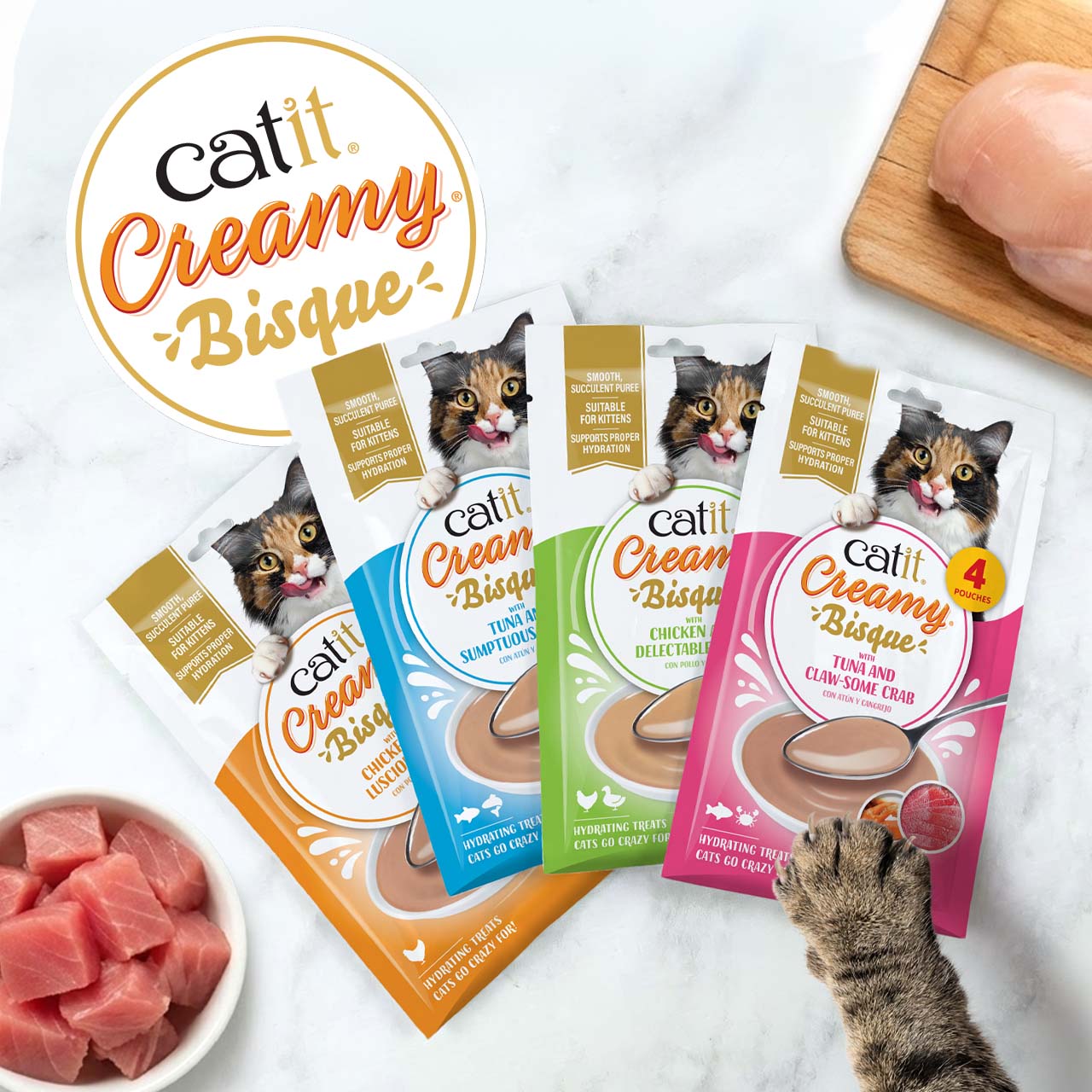 Catit Creamy Bisque cat treat pouches in four flavors: chicken, tuna, chicken and tuna, and tuna and crab